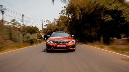 Car travelling on a tree-lined road
